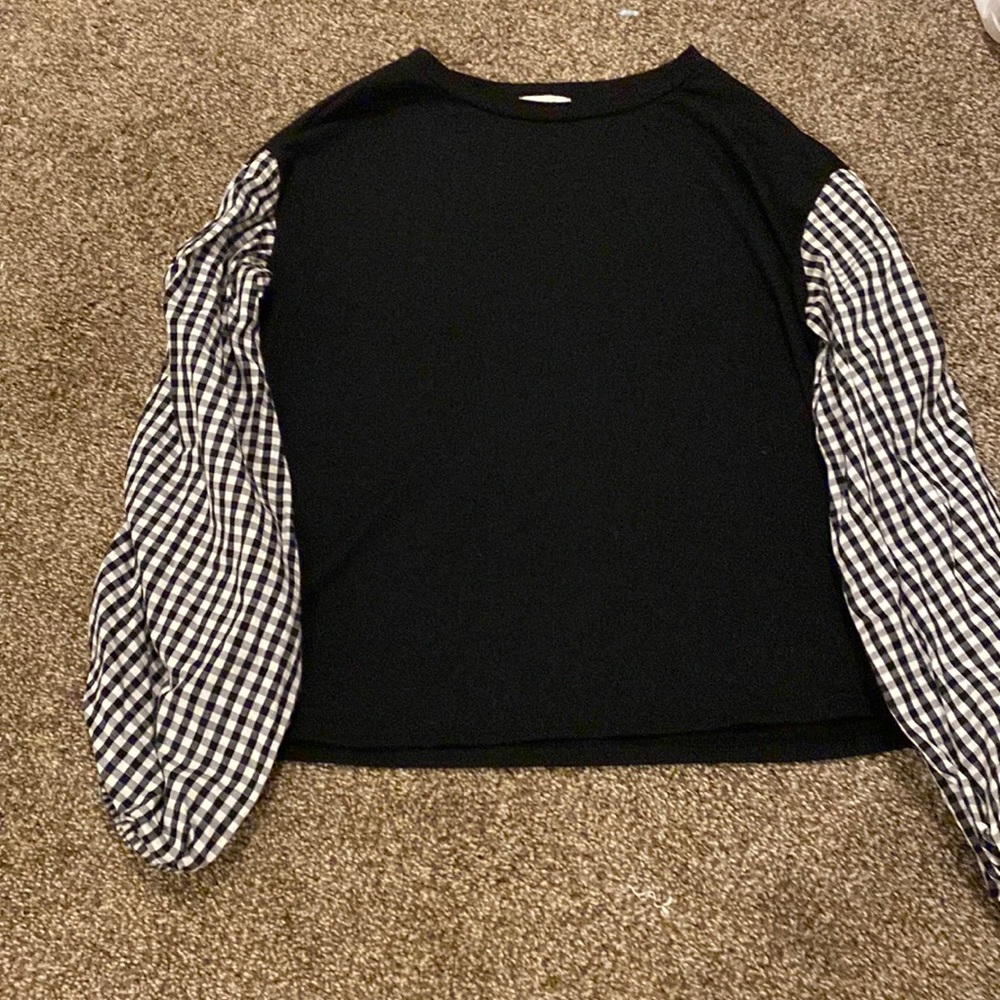 Black long sleeve with black and white checkered sleeves.